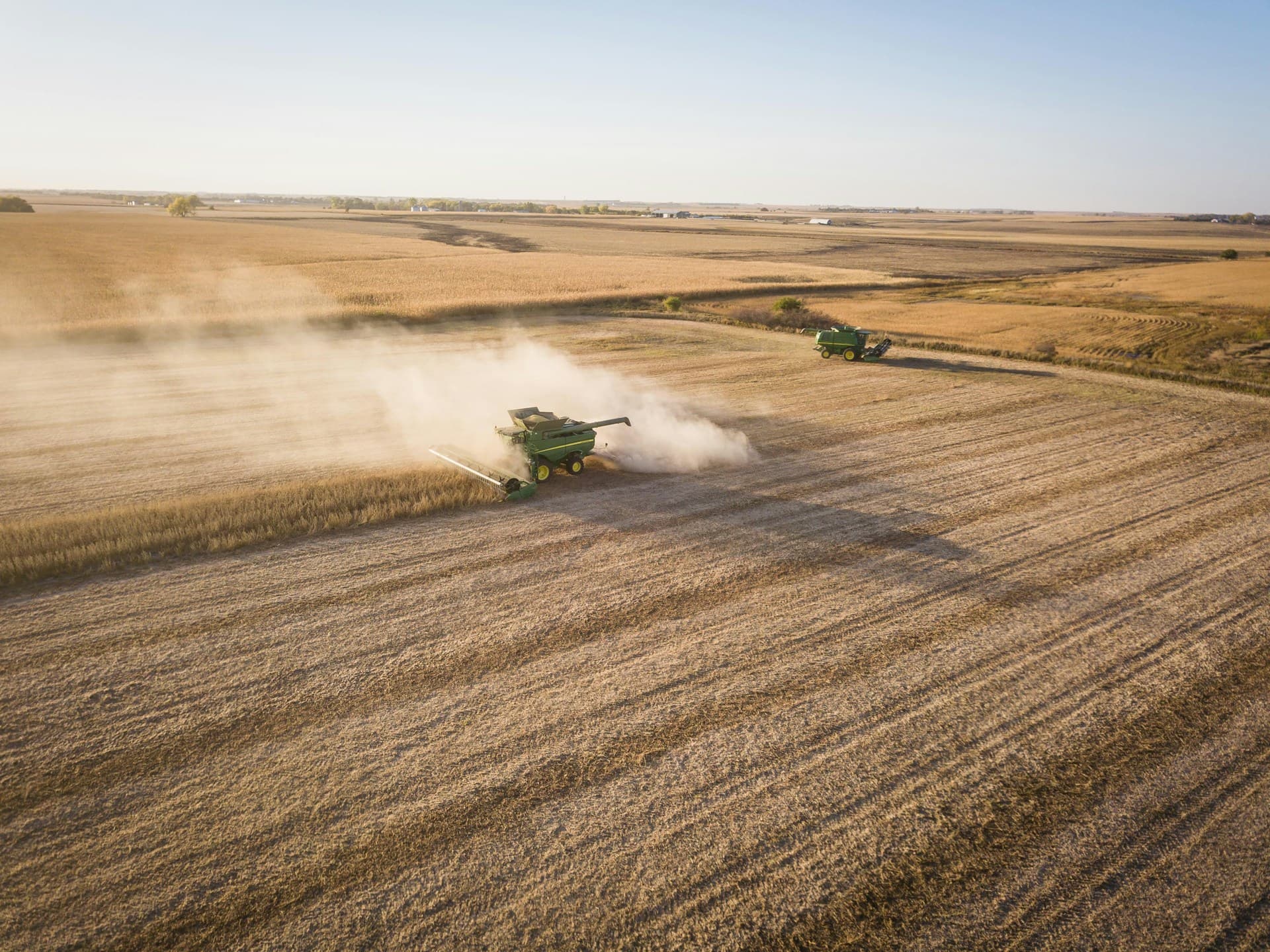Aerial view of combine harvester working in a soy field